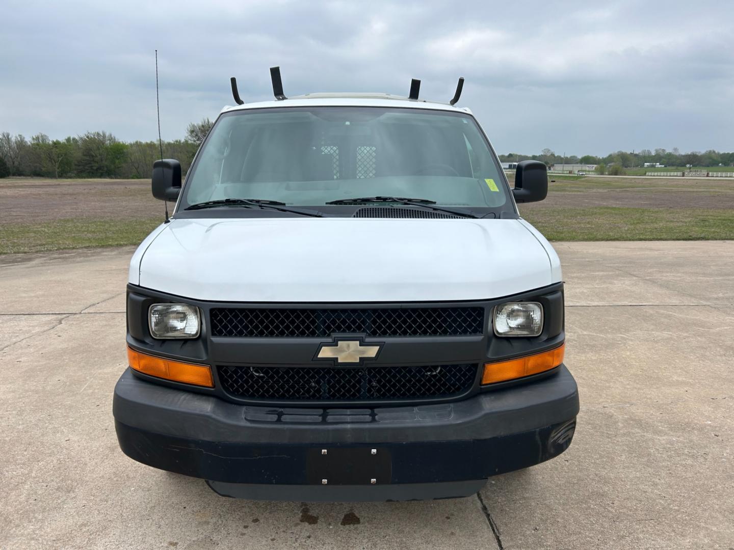 2011 White /Gray Chevrolet Express 2500 Cargo (1GCWGFCB9B1) with an 3.6L V6 DOHC 16V engine, 4-Speed Automatic transmission, located at 17760 Hwy 62, Morris, OK, 74445, (918) 733-4887, 35.609104, -95.877060 - 2011 CHEVY EXPRESS HAS THE 3.6L V6 ENGINE. THIS IS A DEDICATED CNG (ONLY RUNS ON COMPRESSED NATURAL GAS). MANUAL SEATS, MANUAL LOCKS, MANUAL, MIRRORS, MANUAL WINDOWS, AMFM STEREO, A/C, LEATHER SEATS, LEATHER-WRAPPED STEERING WHEEL, TRACTION CONTROL, LOCKING METAL CONSOLE, STEEL SHELVES, SPLIT SWING- - Photo#1